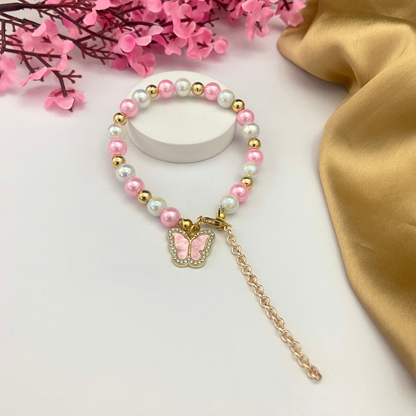 Stretchable Light Weight Bead Bracelet With Stone Studded Pink Butterfly Charm