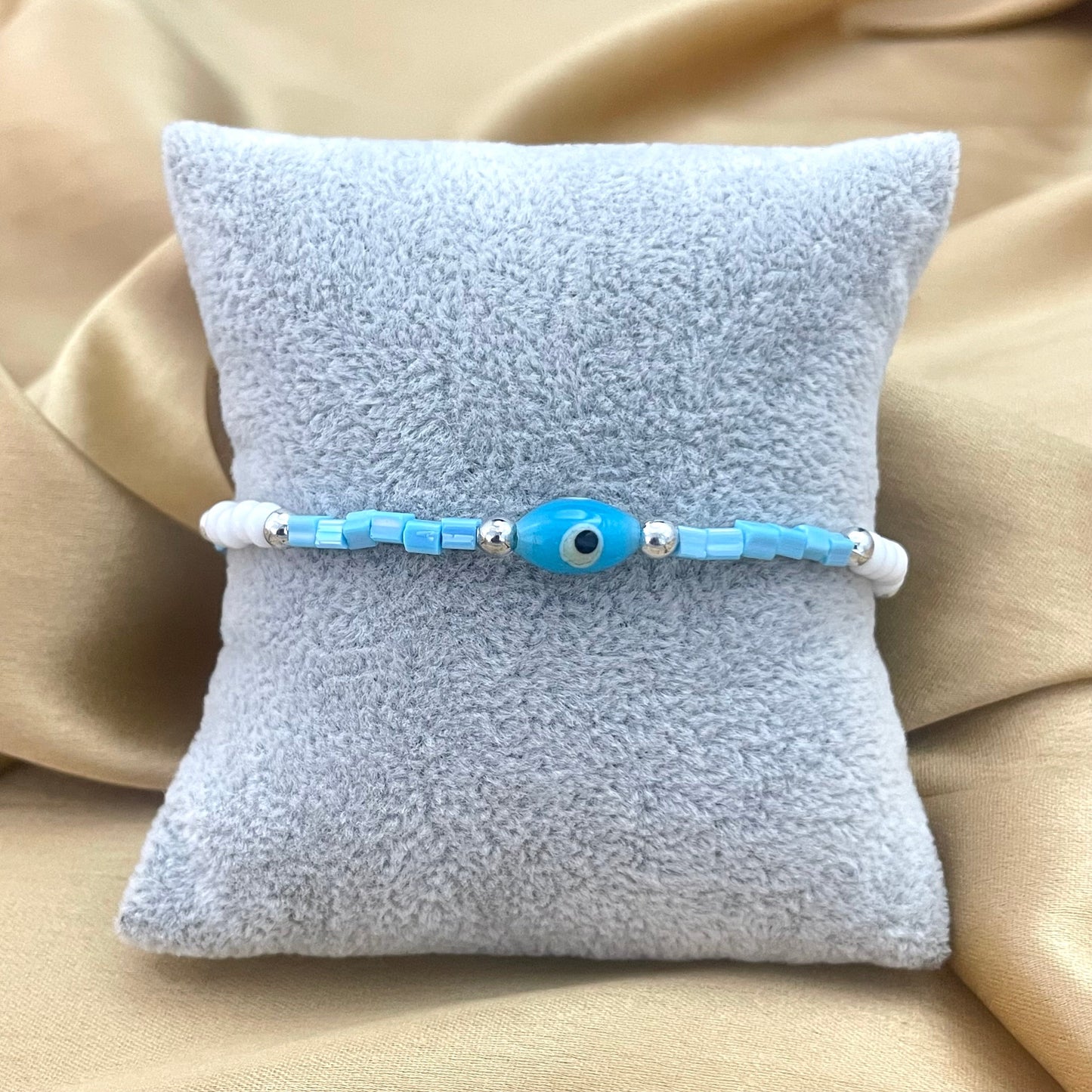 Stretchable Blue & White Bead Bracelet With Evil Eye