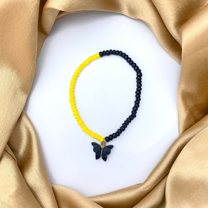 Stretchable Yellow & Black Joco Beads Bracelet  With Black Butterfly Charm